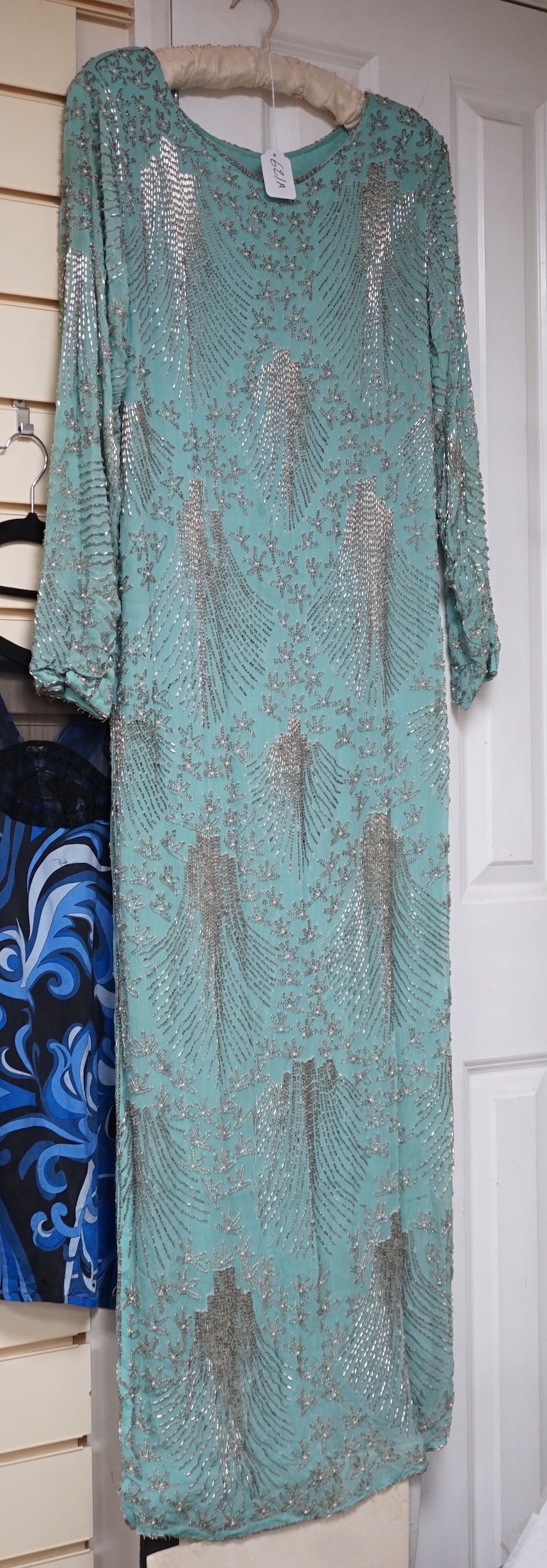 A 1940's turquoise chiffon evening dress and peacock designed shawl owned by Princess Sevilla Hercolani